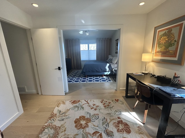 bedroom with recessed lighting, visible vents, baseboards, and light wood finished floors