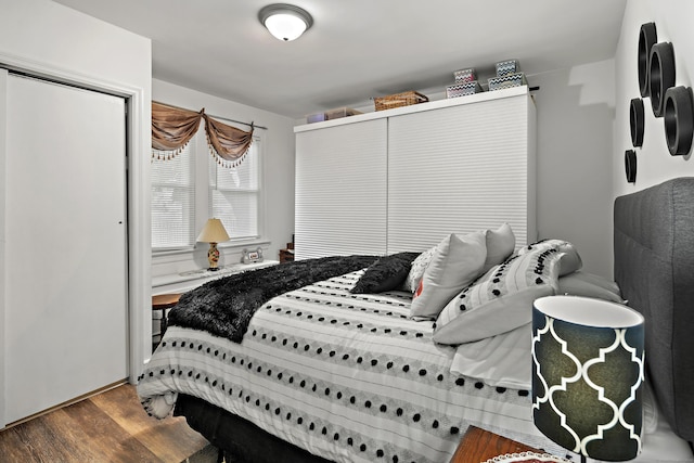 bedroom featuring wood finished floors