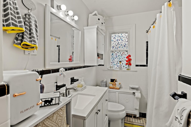 full bathroom with vanity, toilet, tile walls, and a shower with curtain