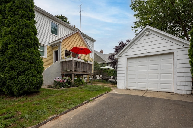 detached garage with aphalt driveway