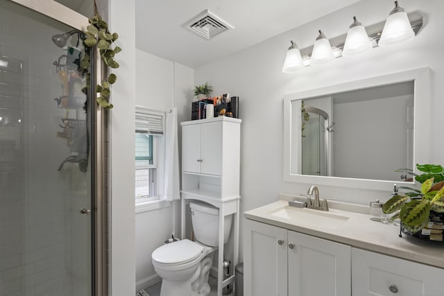 full bathroom with vanity, toilet, visible vents, and a stall shower