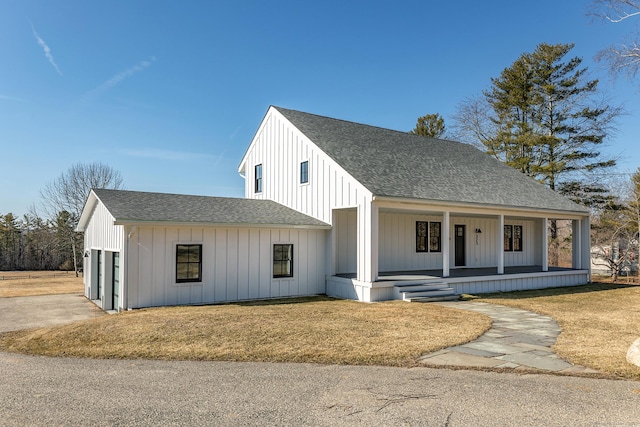 modern farmhouse style home featuring board and batten siding, a porch, a garage, and roof with shingles