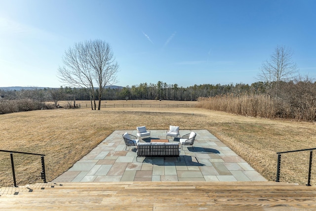view of patio / terrace with a rural view