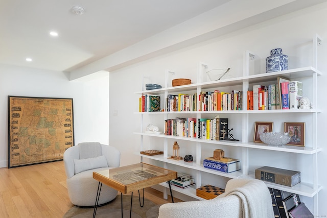 living area with recessed lighting and wood finished floors