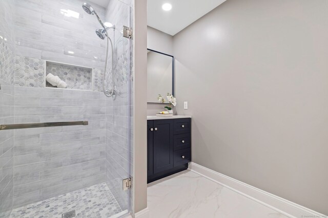 full bathroom featuring marble finish floor, a stall shower, recessed lighting, baseboards, and vanity