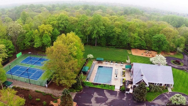 drone / aerial view featuring a forest view