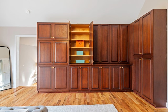 215 Paddock Hill Ln, Fairfield, CT 06824 - unfurnished living room with light wood-type flooring and vaulted ceiling