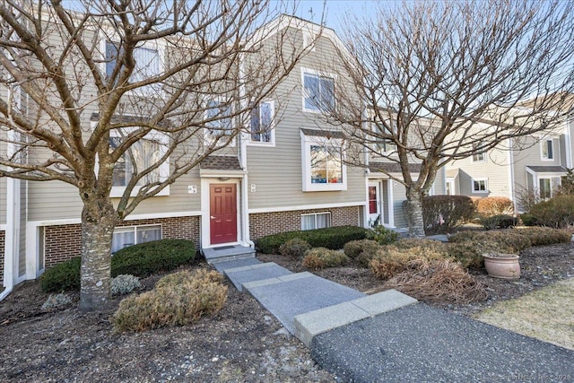 view of front of house with brick siding