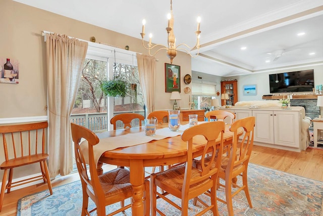 dining area featuring recessed lighting, ceiling fan with notable chandelier, beam ceiling, and light wood finished floors