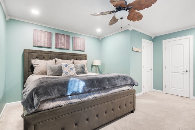 carpeted bedroom featuring recessed lighting, baseboards, ornamental molding, and a ceiling fan