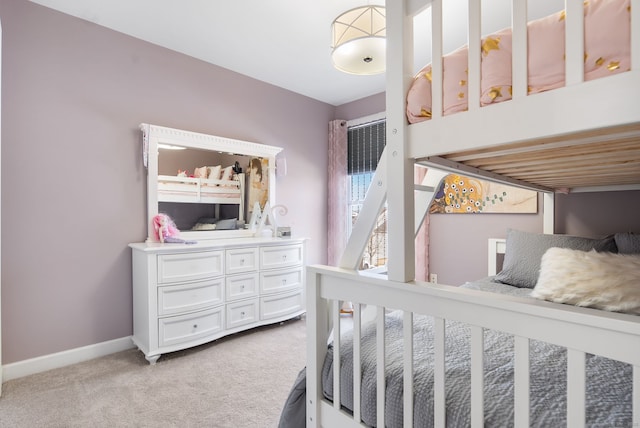 bedroom featuring carpet flooring and baseboards