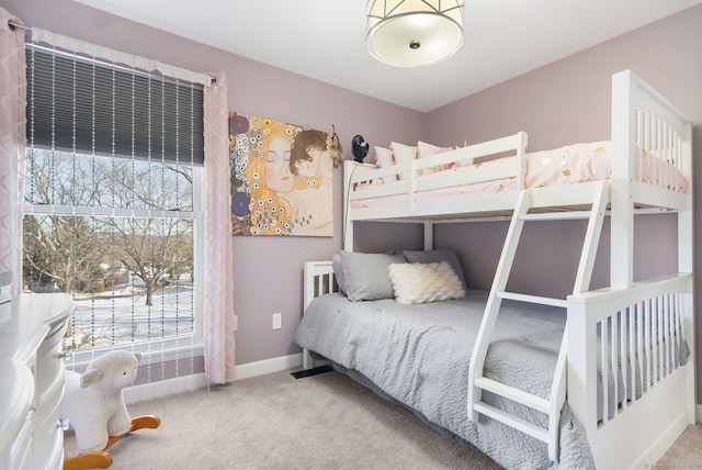 carpeted bedroom with baseboards