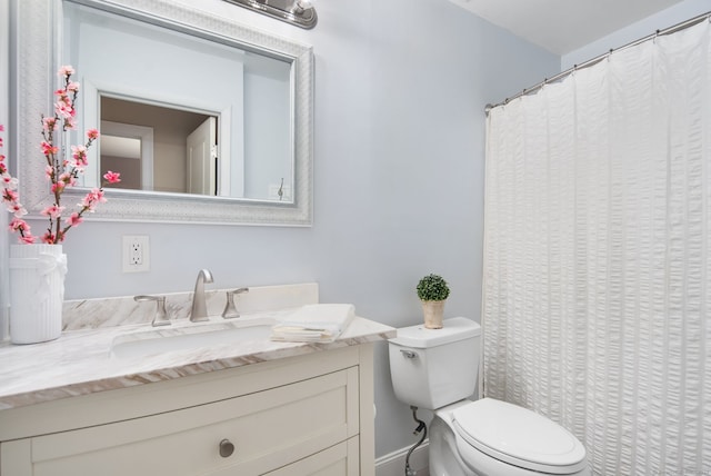 full bath with toilet and vanity