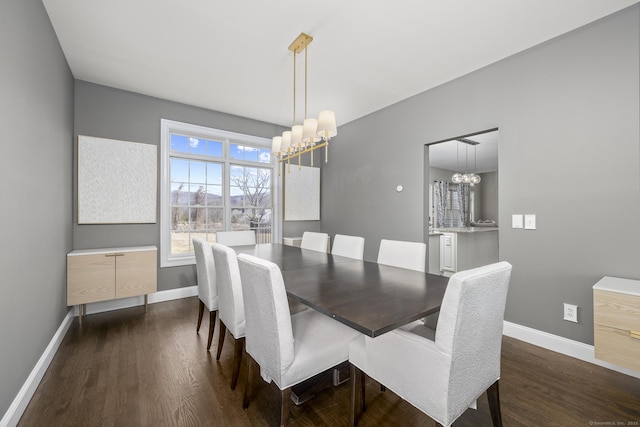 dining space with an inviting chandelier, dark wood-style floors, and baseboards