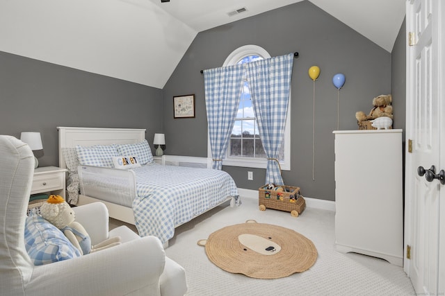 carpeted bedroom with visible vents, lofted ceiling, and baseboards