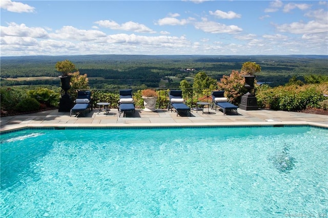 pool with a patio area