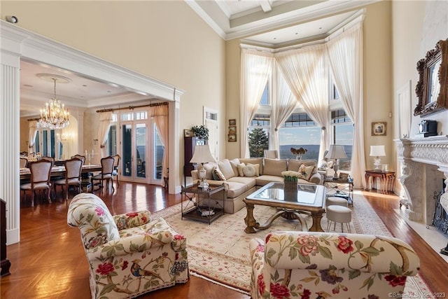 23 Robkins Rd, Avon, CT 06001 - living room with a high ceiling, ornamental molding, a chandelier, and a wealth of natural light