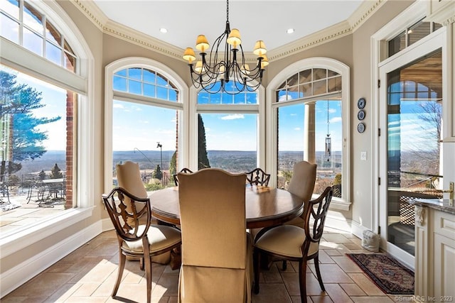 sunroom / solarium featuring a notable chandelier