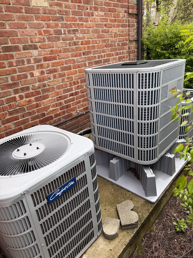 23 Robkins Rd, Avon, CT 06001 - exterior details featuring central air condition unit and brick siding