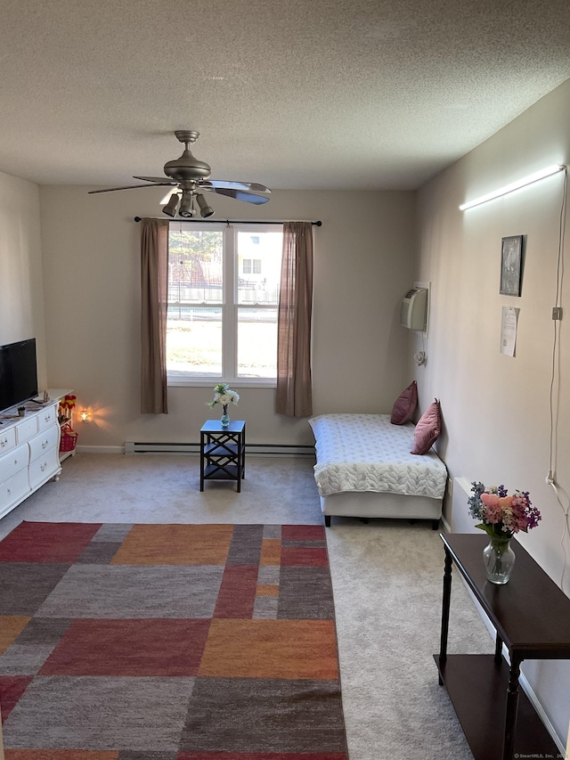 bedroom with carpet, a wall mounted air conditioner, and a textured ceiling