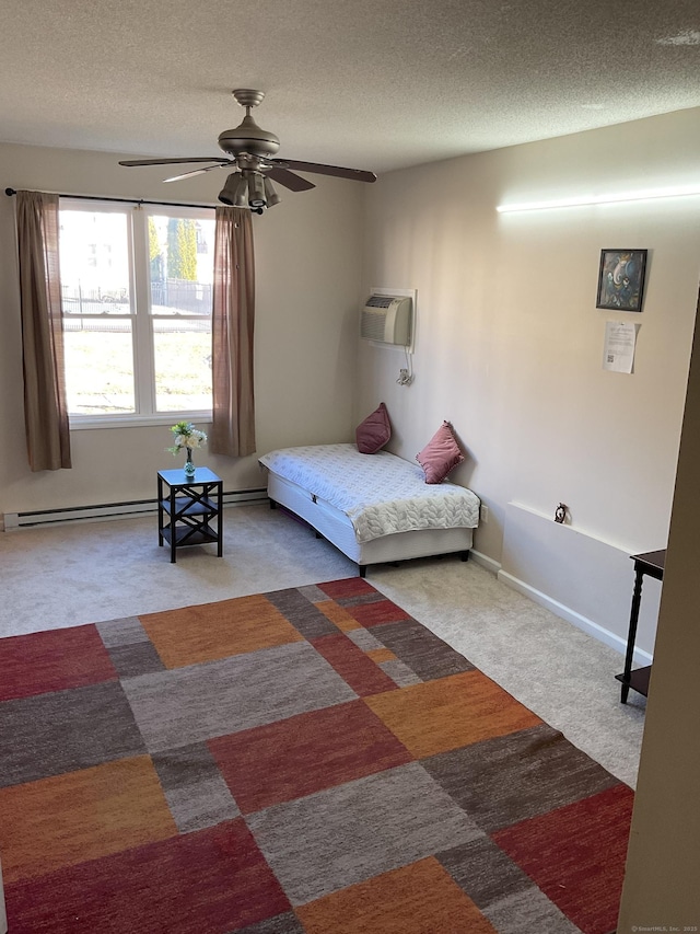 bedroom with a wall unit AC, a baseboard radiator, carpet floors, and a textured ceiling