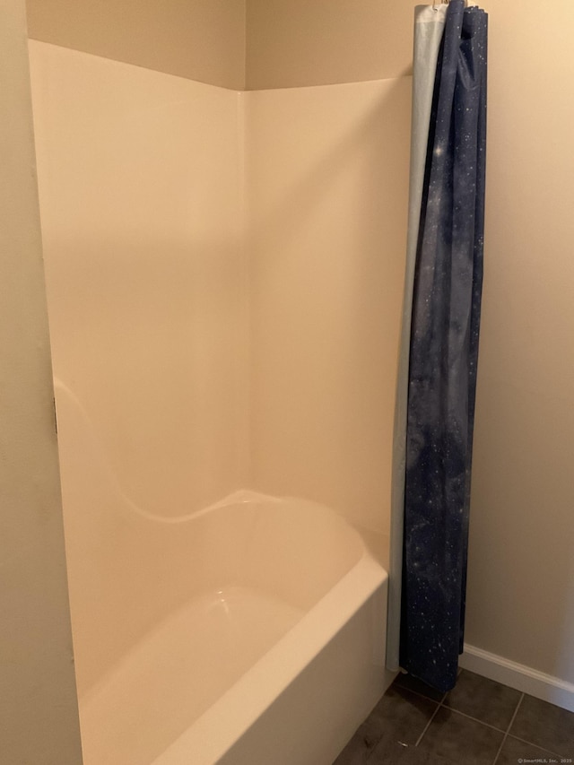 bathroom with tile patterned floors and baseboards