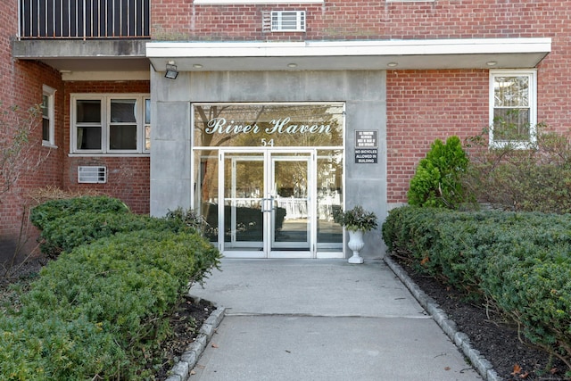 entrance to property with french doors and brick siding