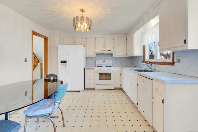 kitchen featuring a sink, under cabinet range hood, white appliances, light countertops, and light floors