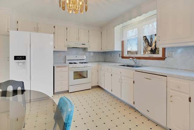 kitchen featuring under cabinet range hood, a sink, white appliances, light countertops, and light floors