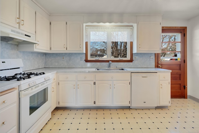 kitchen featuring white appliances, a sink, light countertops, white cabinets, and under cabinet range hood