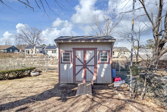 view of shed with a fenced backyard