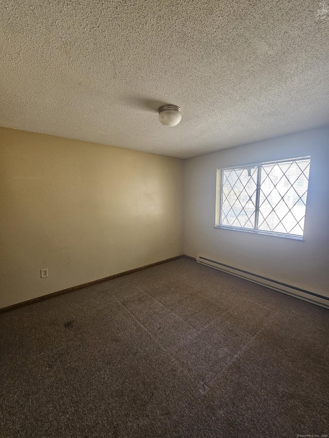 unfurnished room featuring dark colored carpet, a baseboard heating unit, baseboards, and a textured ceiling