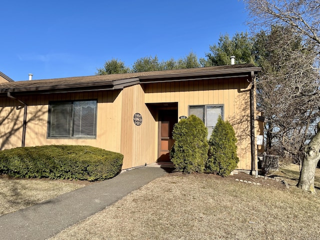 exterior space with a shingled roof