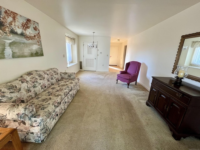 living area with light carpet, baseboards, and an inviting chandelier