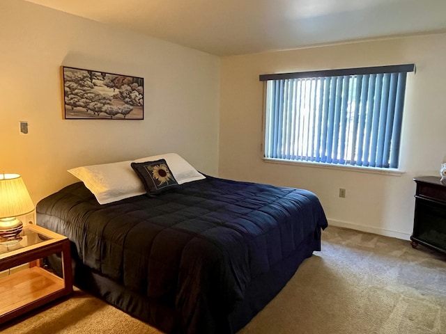 carpeted bedroom with baseboards