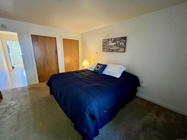 bedroom with baseboards and carpet floors