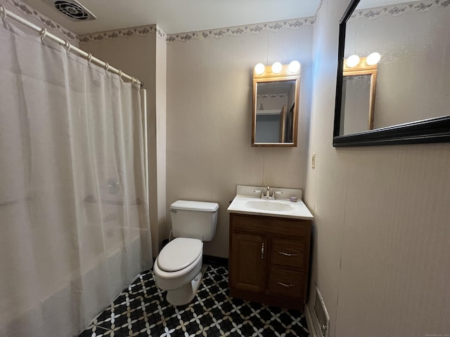 bathroom with visible vents, toilet, and vanity