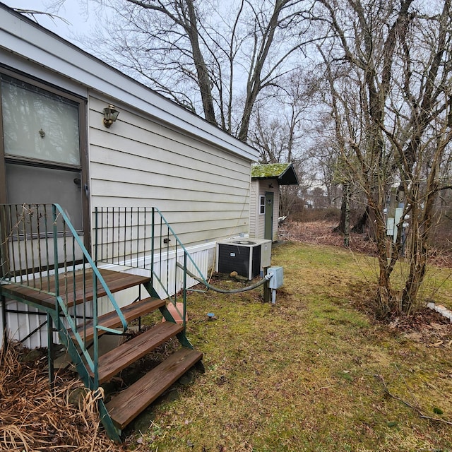 view of yard featuring central AC