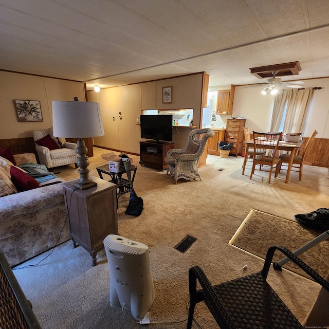 living area featuring light colored carpet