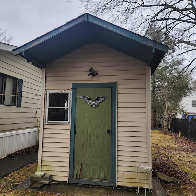 view of shed with fence