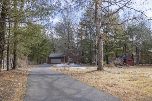 view of front of house featuring an outdoor structure and a garage