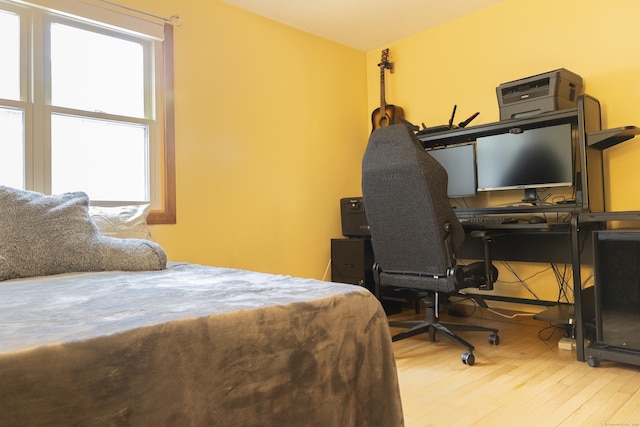 bedroom with wood finished floors