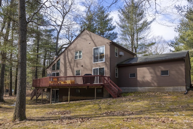 back of property featuring stairway and a deck