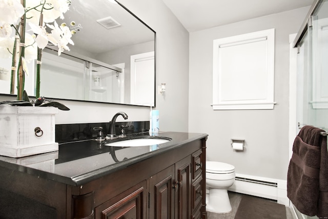 full bathroom featuring visible vents, a shower stall, a baseboard heating unit, toilet, and vanity