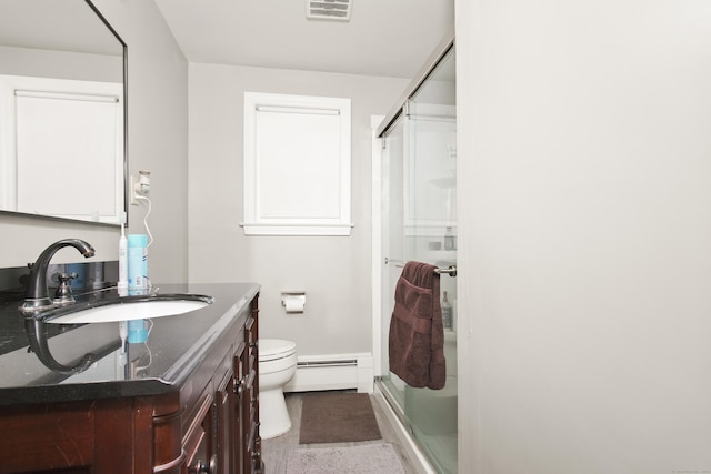 full bath featuring vanity, visible vents, a baseboard radiator, a stall shower, and toilet