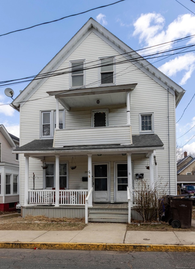 view of front facade featuring a porch and a balcony