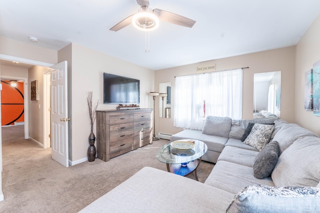 living area with a ceiling fan, light colored carpet, baseboards, and a baseboard radiator