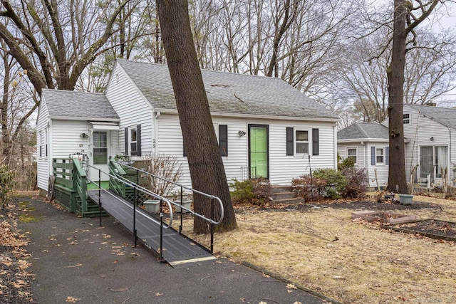 view of front of property featuring roof with shingles