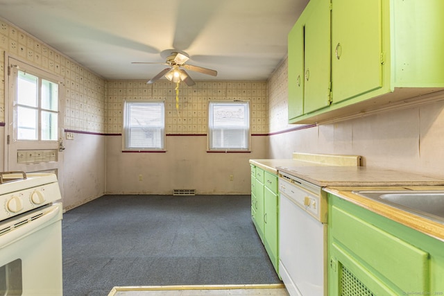 kitchen with visible vents, white appliances, carpet flooring, light countertops, and green cabinetry