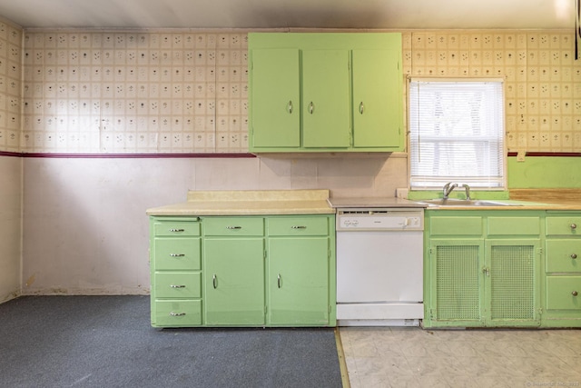 kitchen featuring a sink, dishwasher, and green cabinets